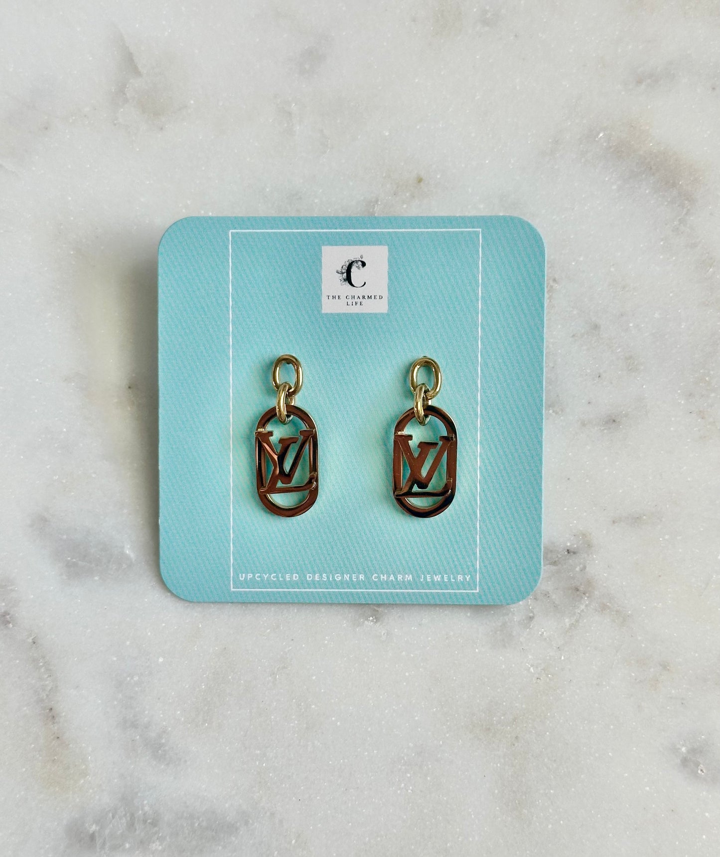 LV gold tone earrings