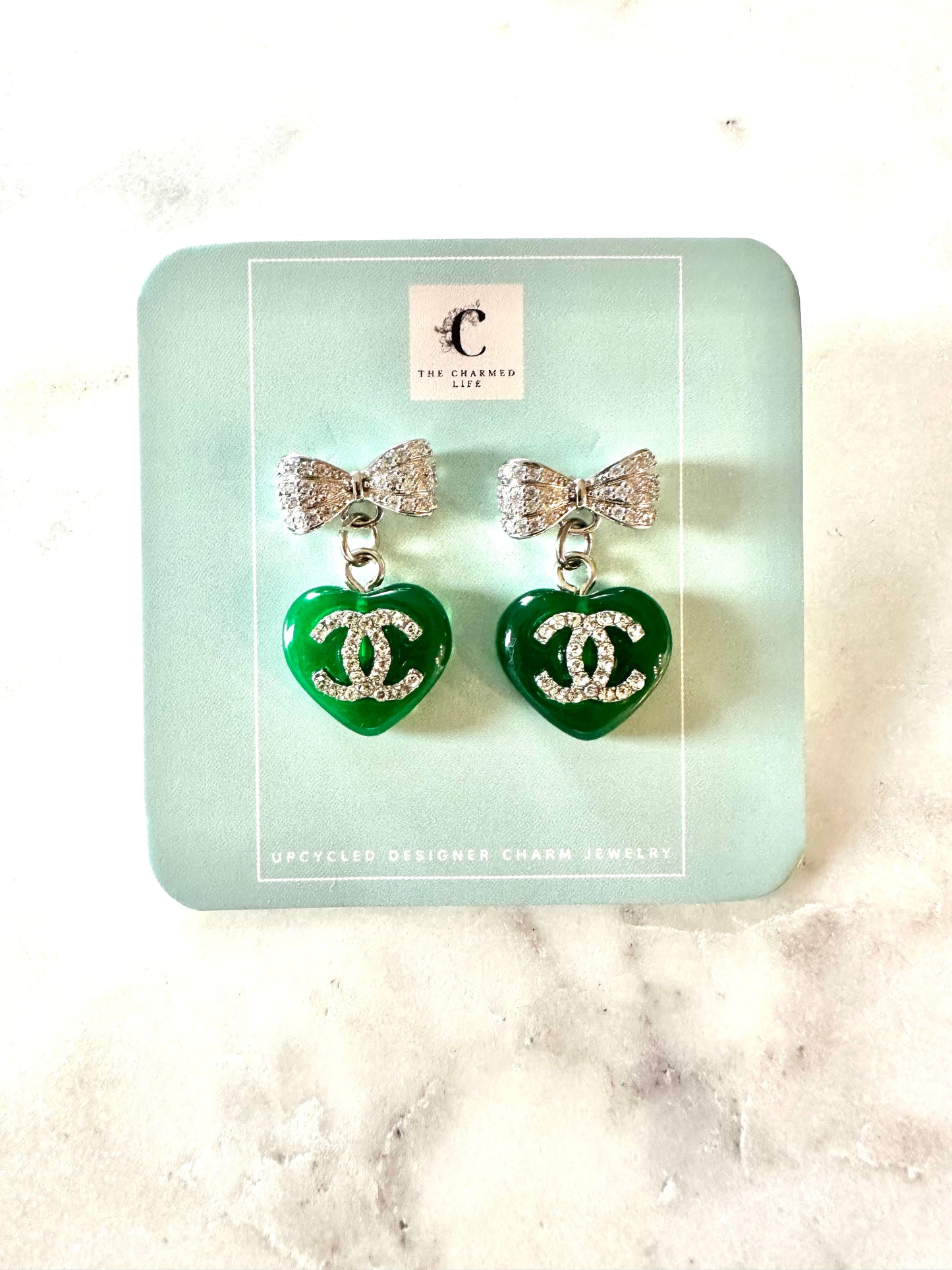 CC green heart bow pendant earrings