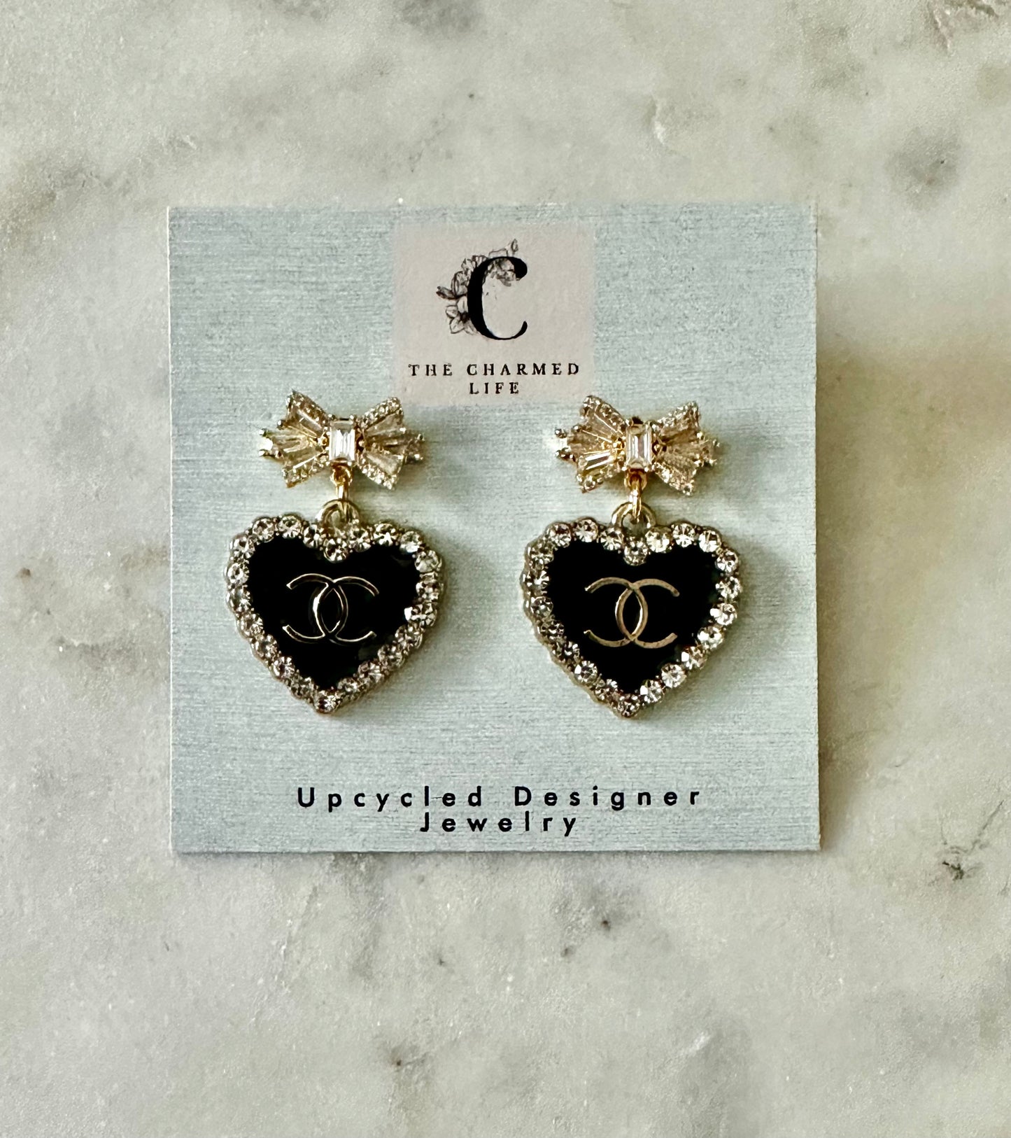 CC black heart bow earrings