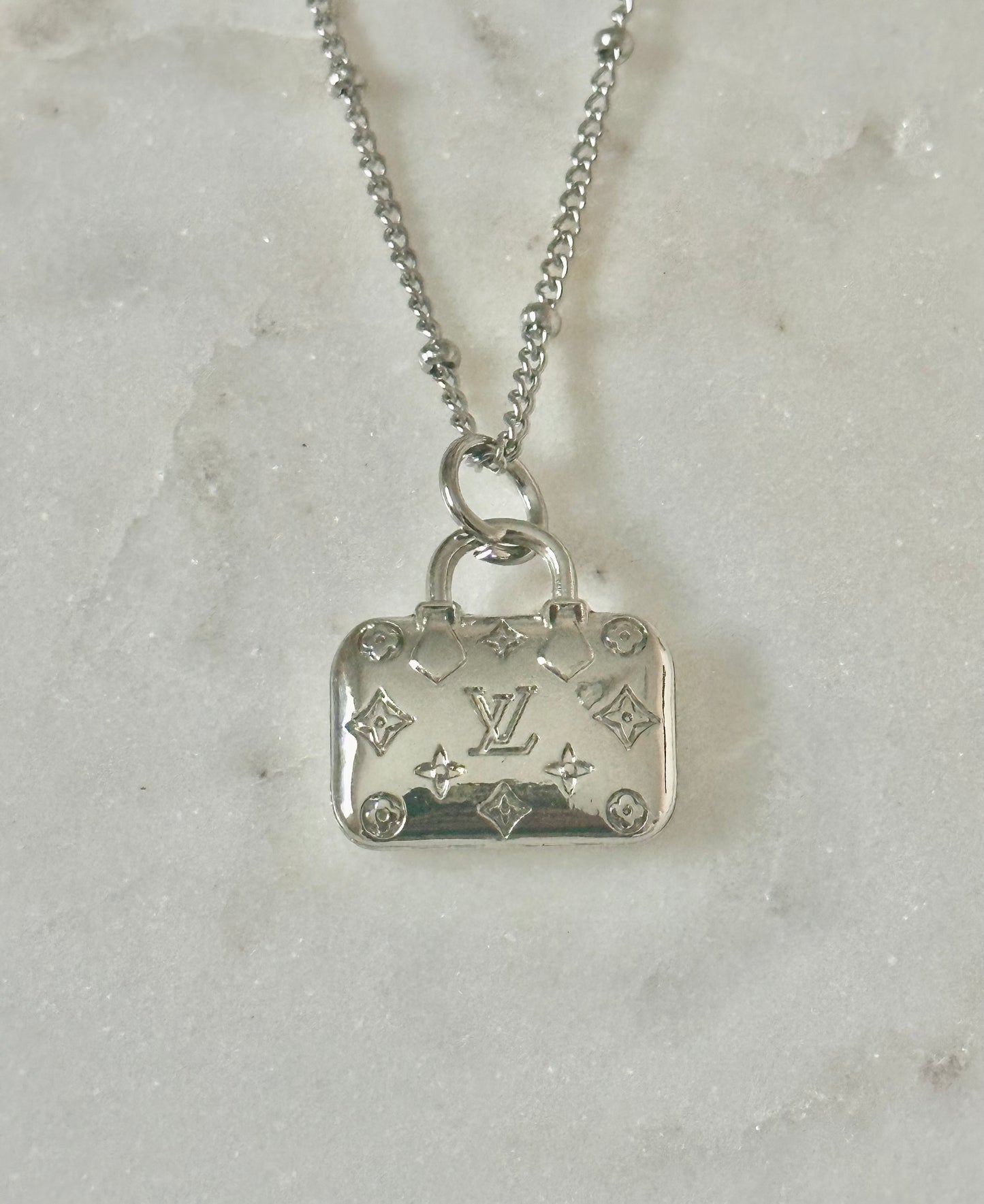 LV purse necklace