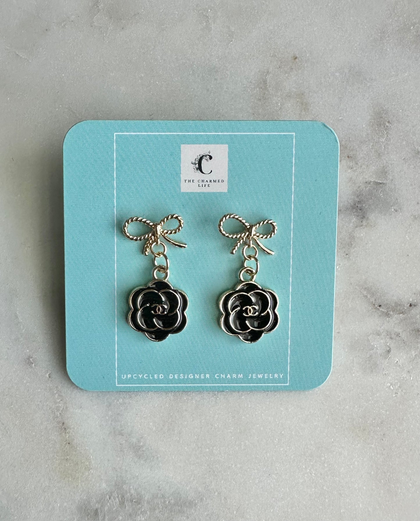 CC camellia black bow earrings