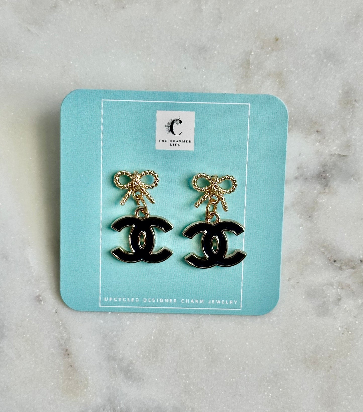 CC black and bow earrings