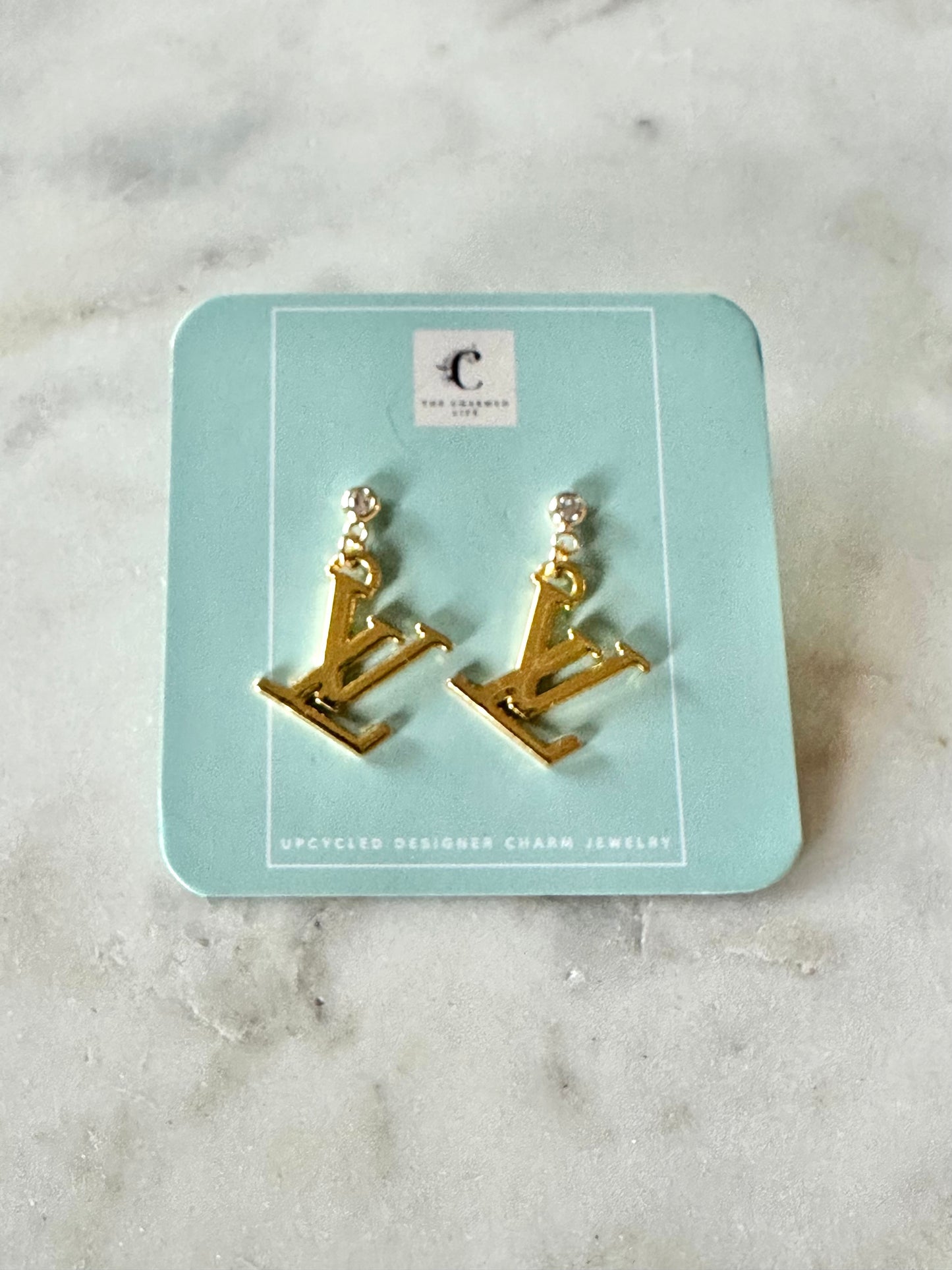 LV with rhinestone earrings