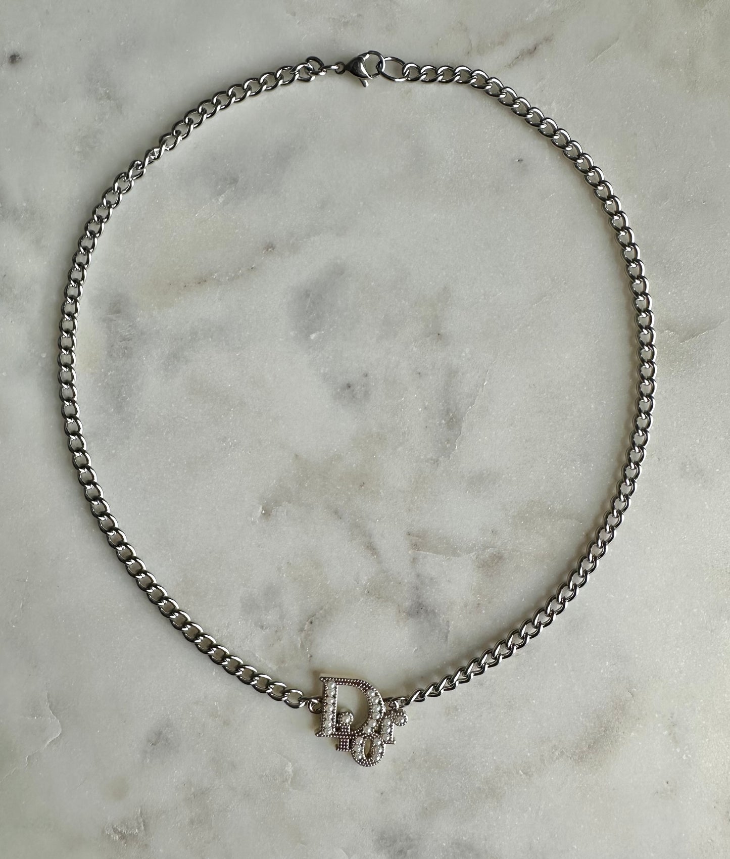 Dior with faux pearl necklace