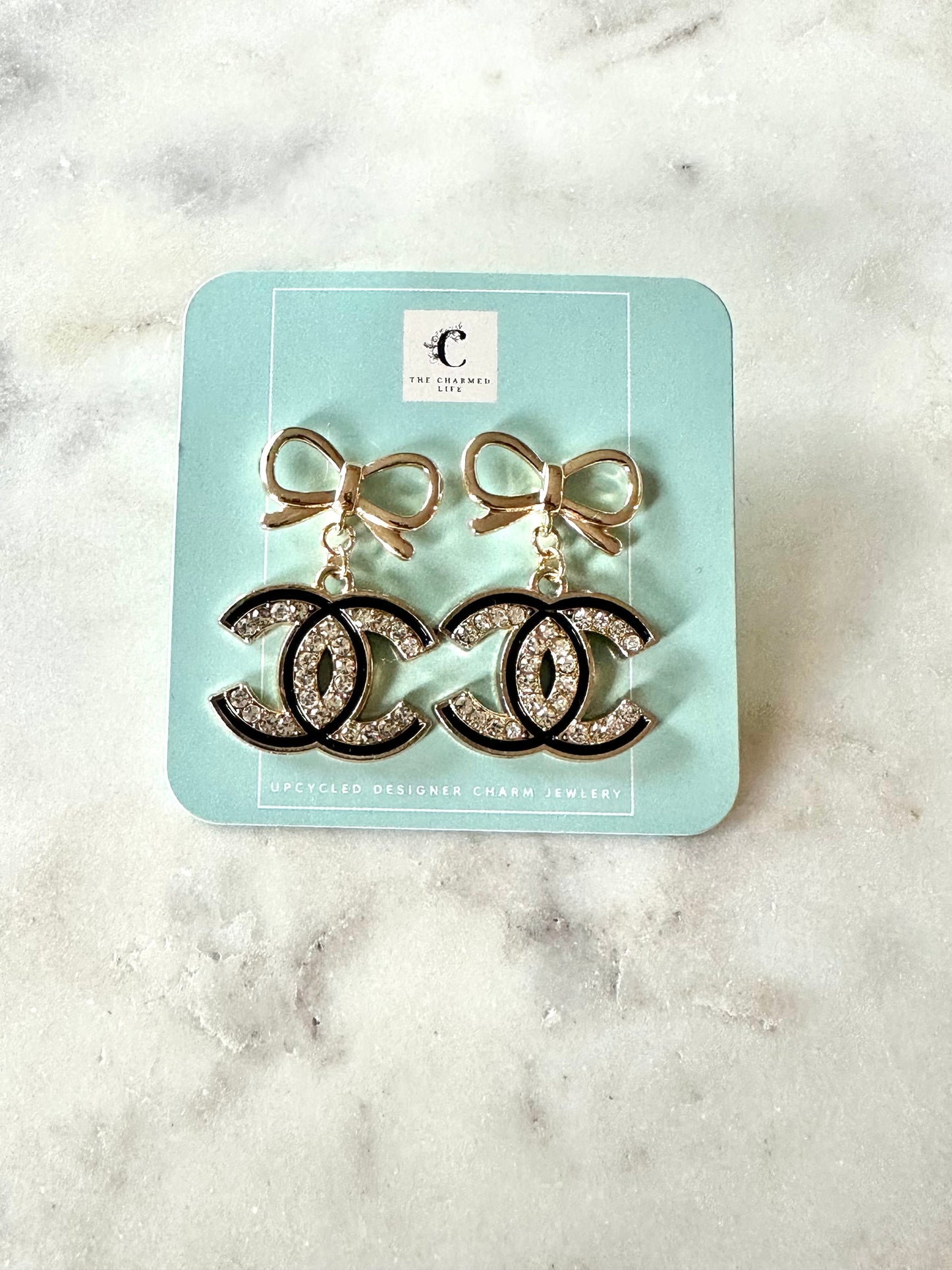 CC black and rhinestones bow pendant earrings