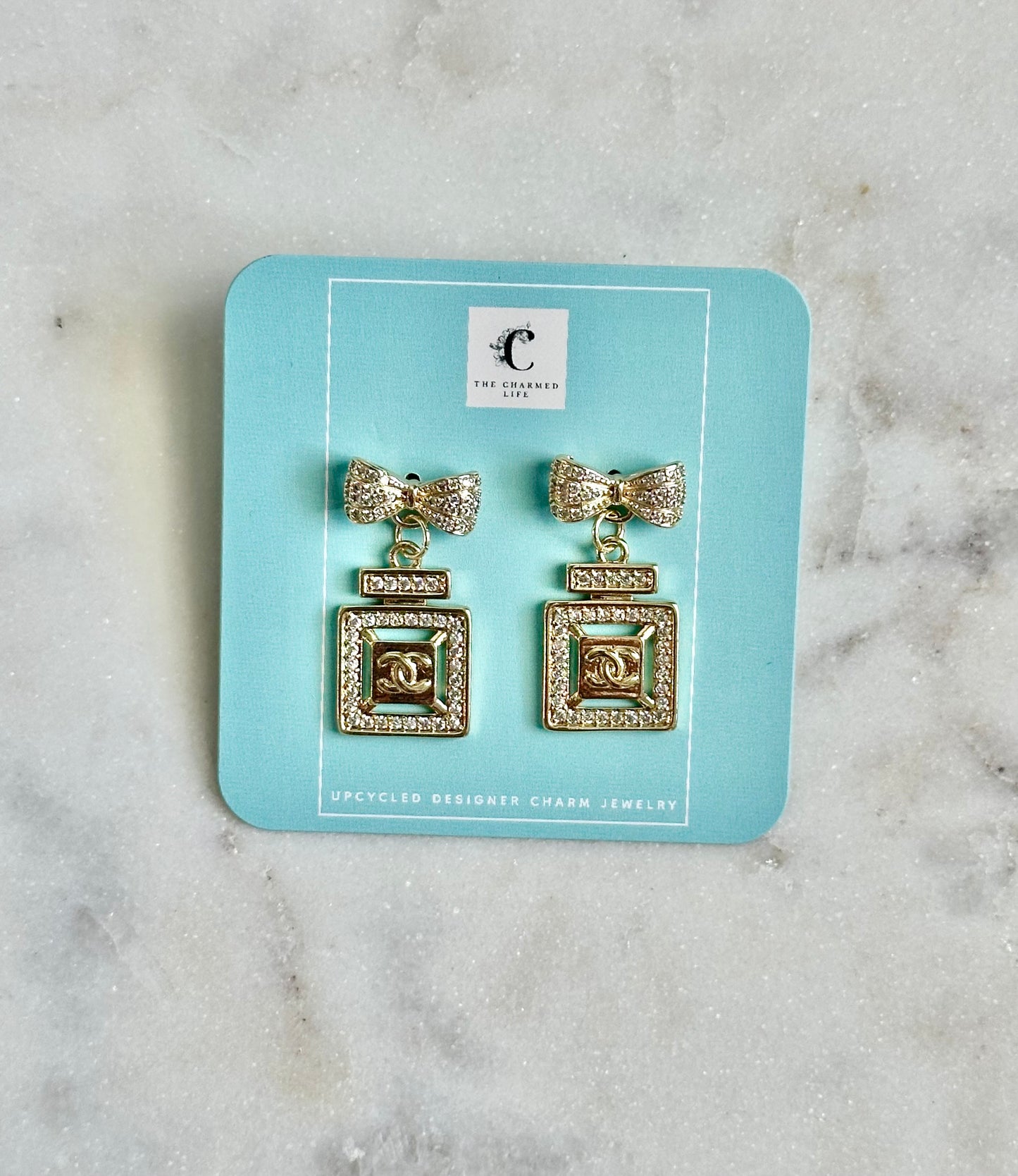 CC perfume bottle bow earrings