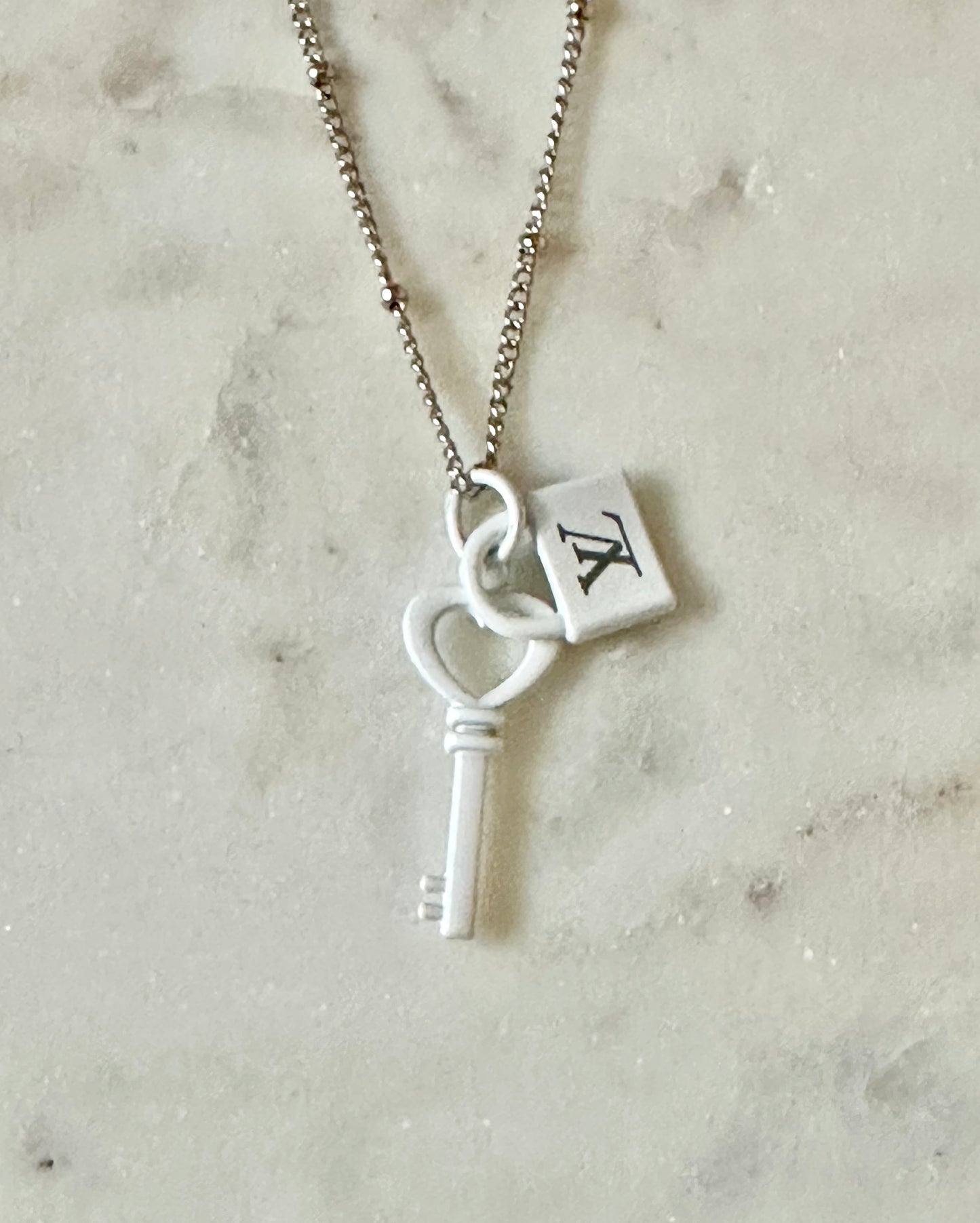 LV white lock and key necklace