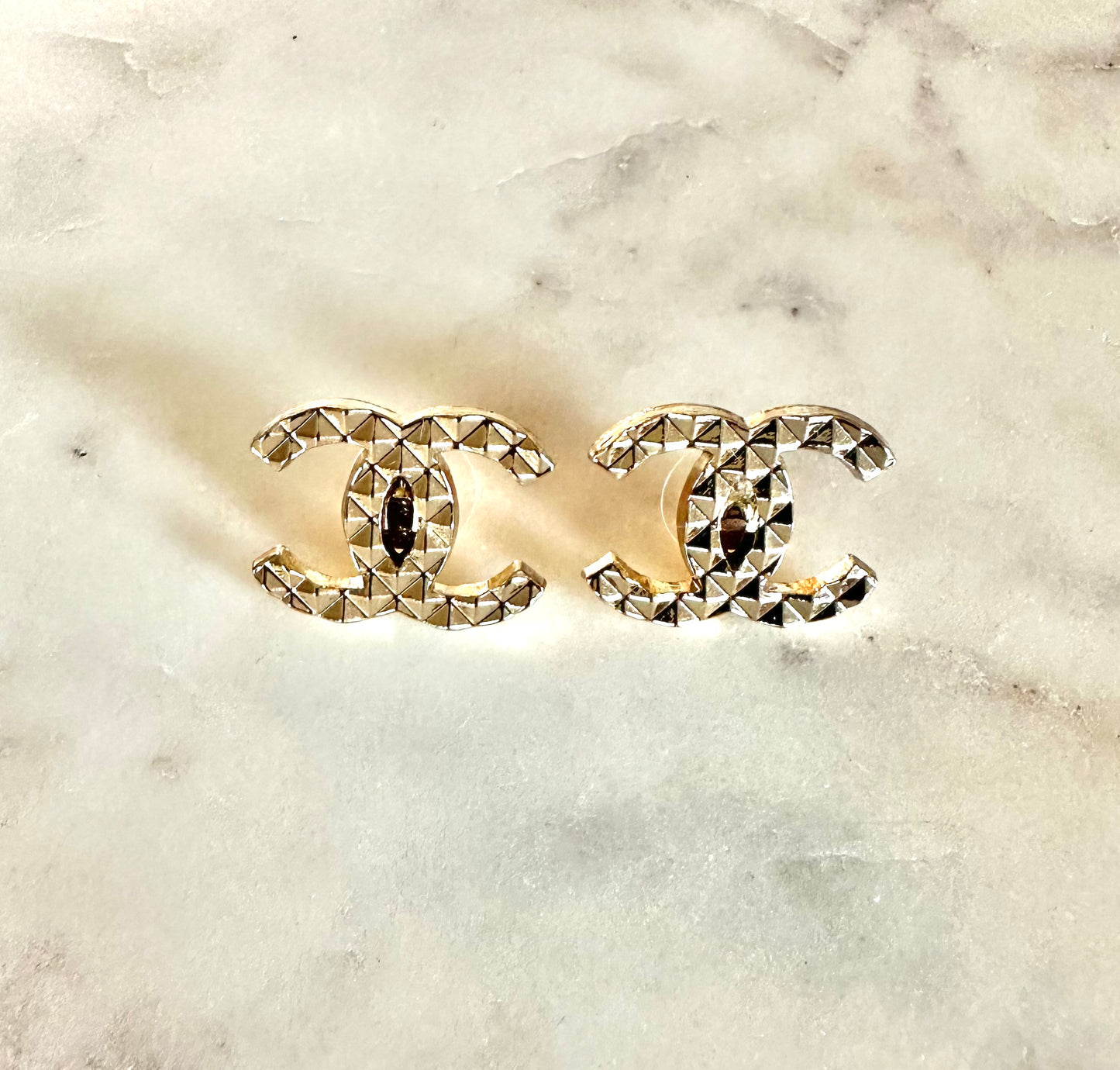 CC gold quilted button earrings