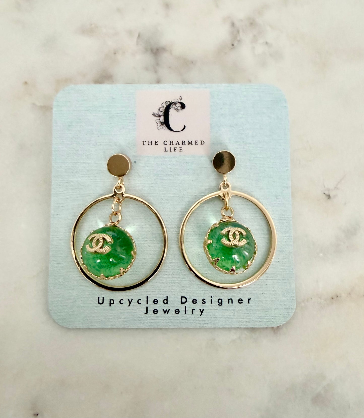 CC green halo ball earrings