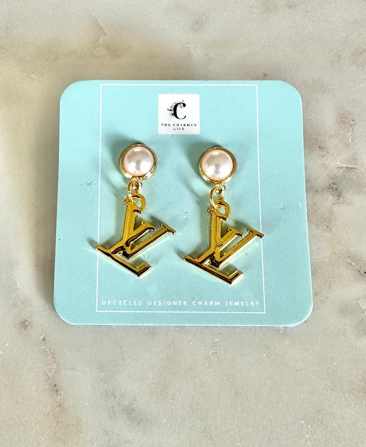 LV with faux pearl earrings