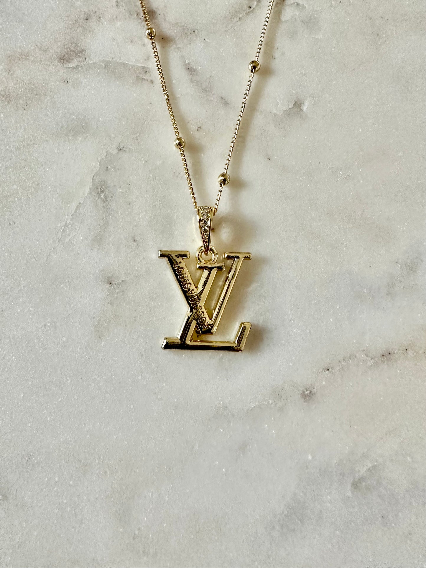 LV gold tone necklace