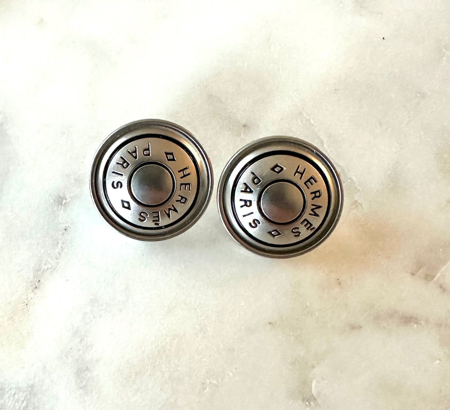 Hermes matte silver button earrings
