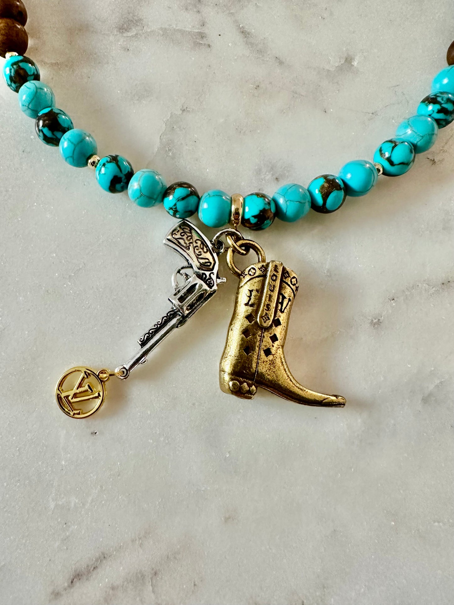 LV boots and gun beaded necklace gold tone
