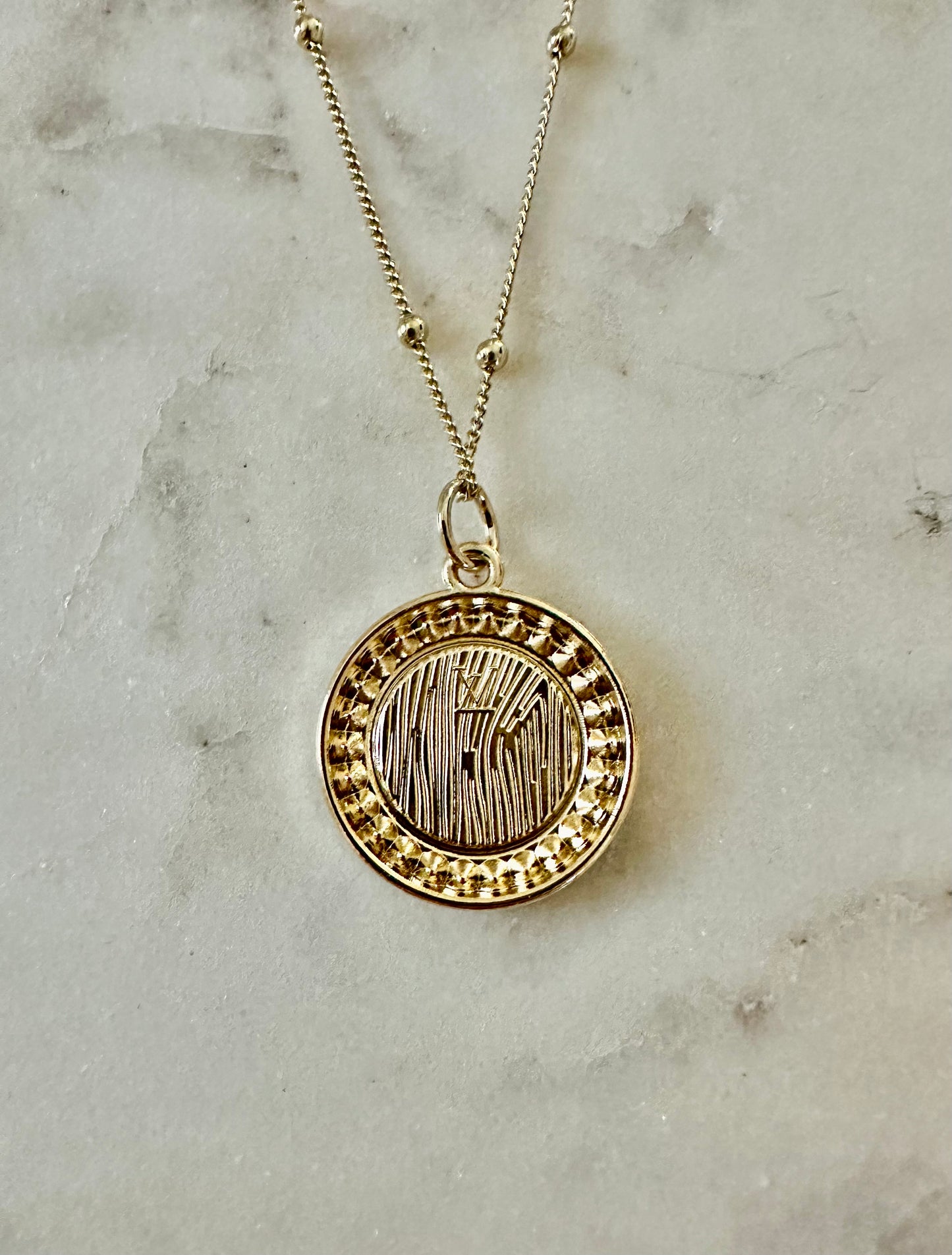 LV iridescent medallion necklace