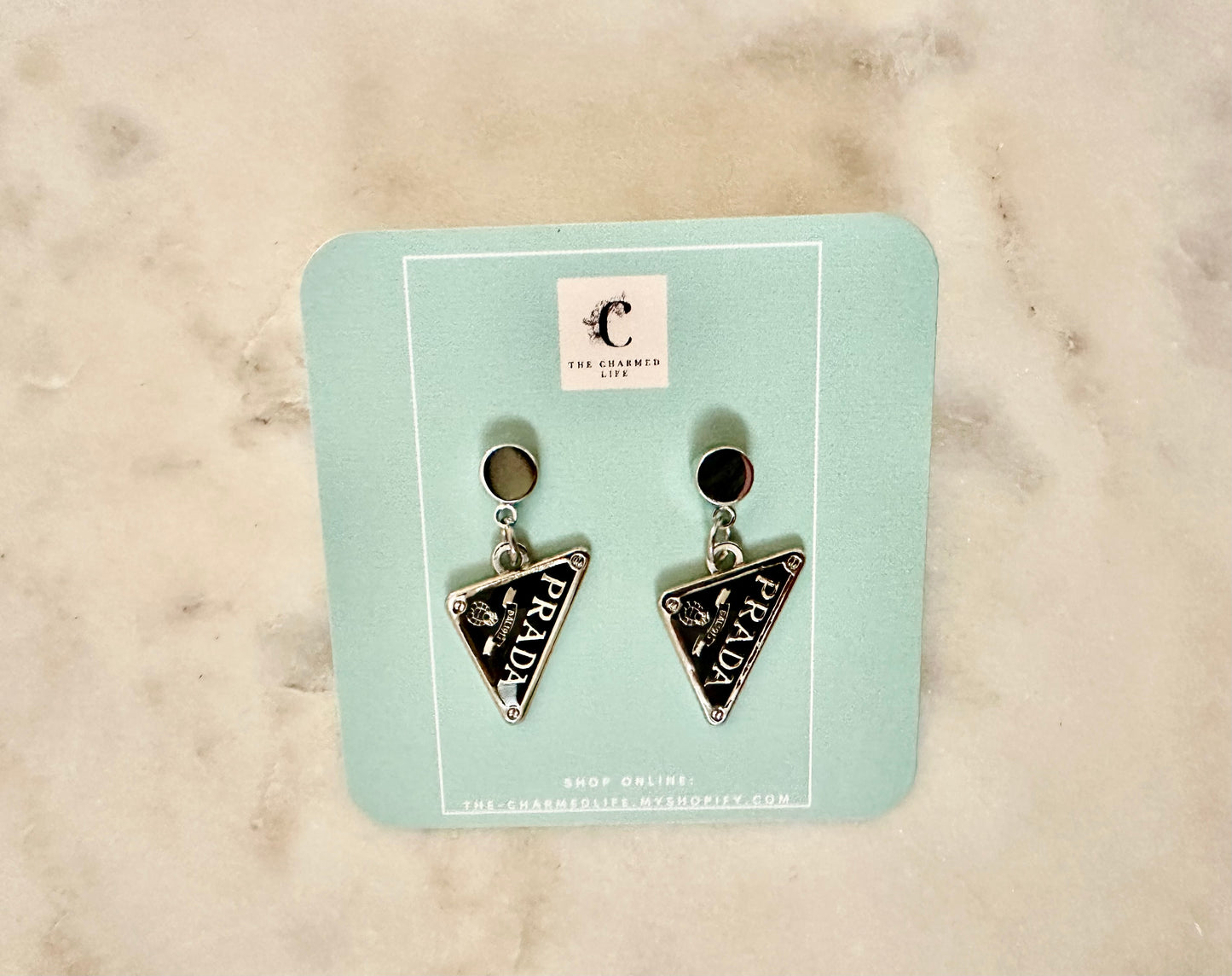Prada Silver tone triangle earrings