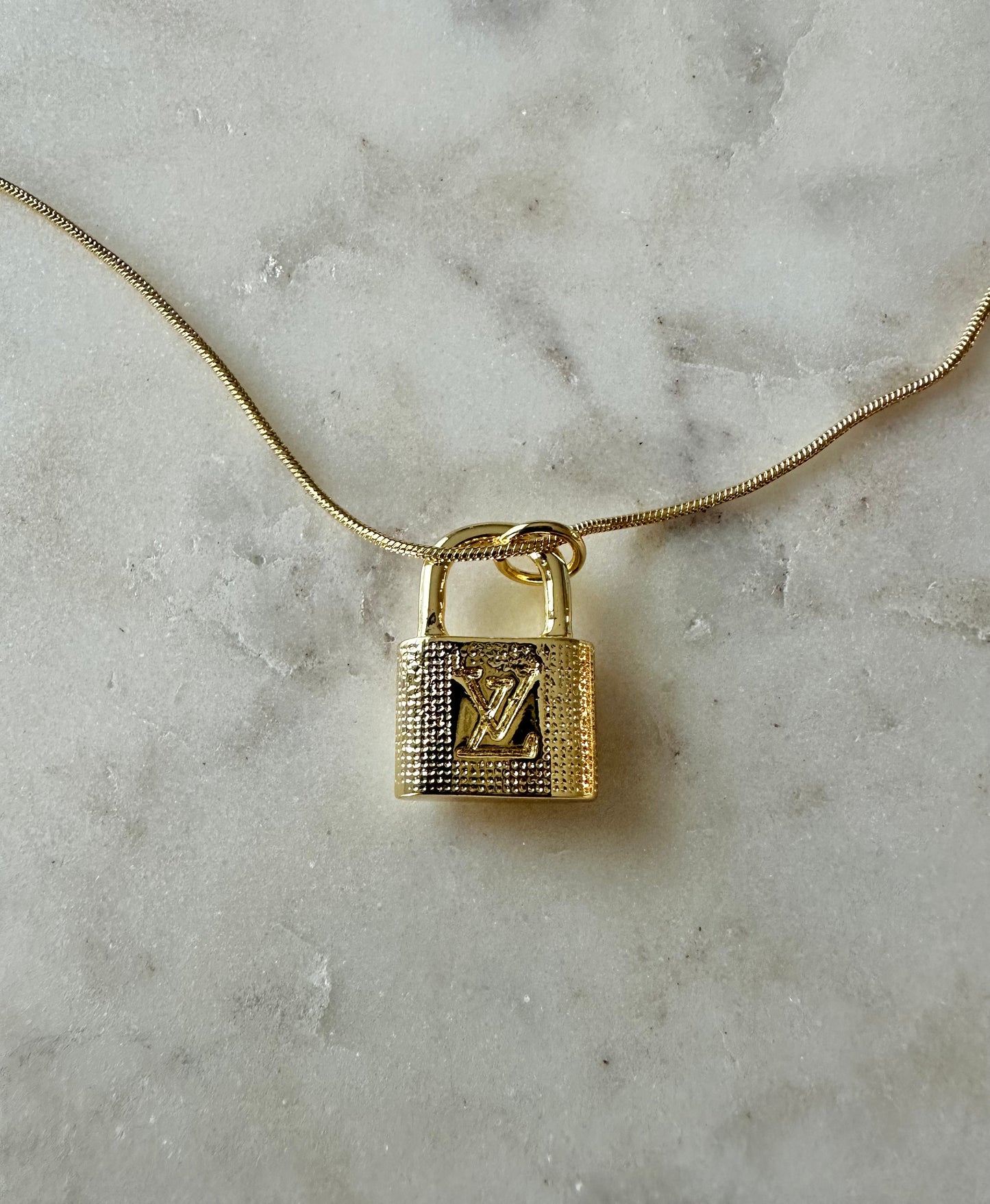 LV gold rhinestone lock necklace 16”