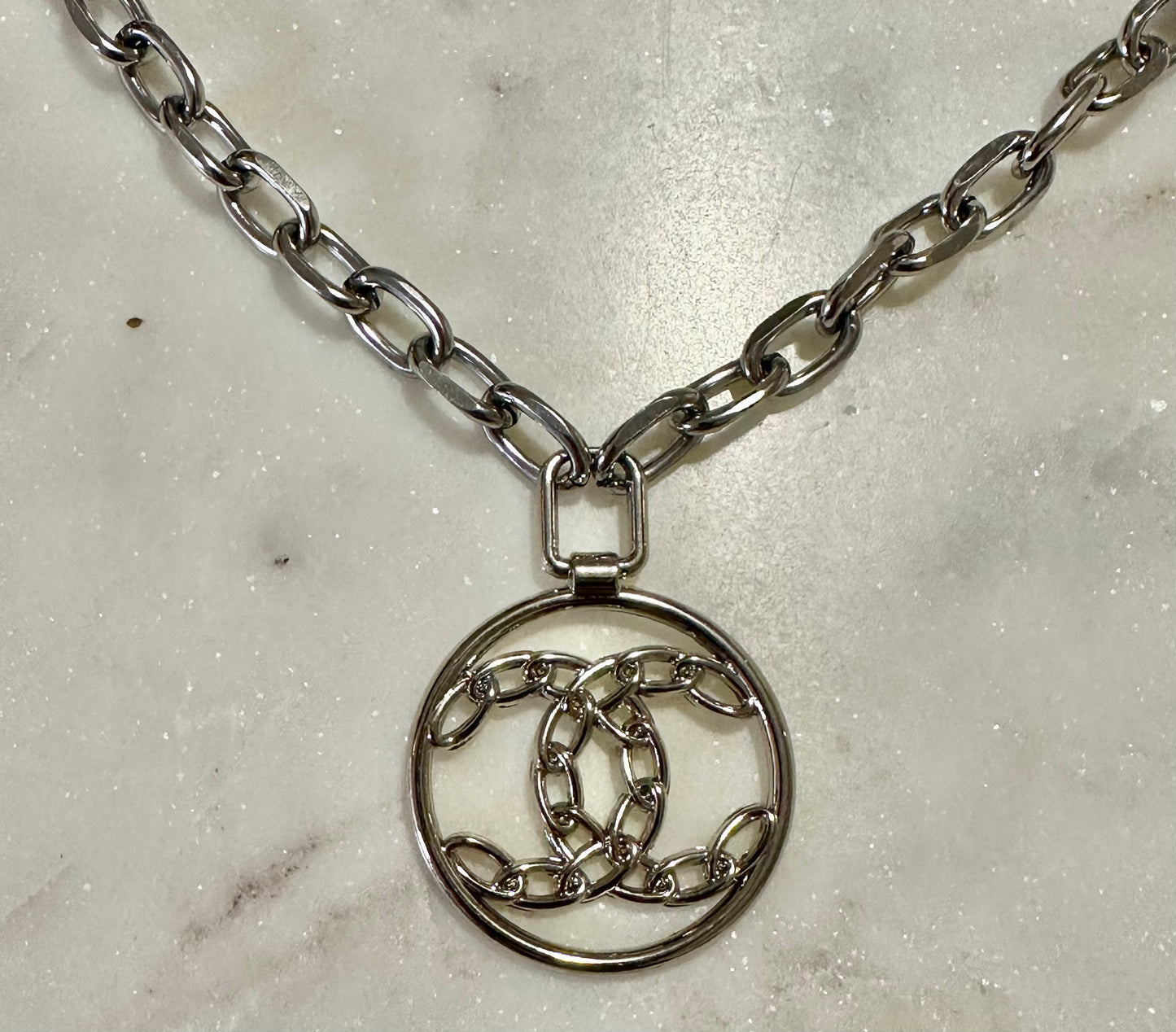 CC braided silver tone necklace