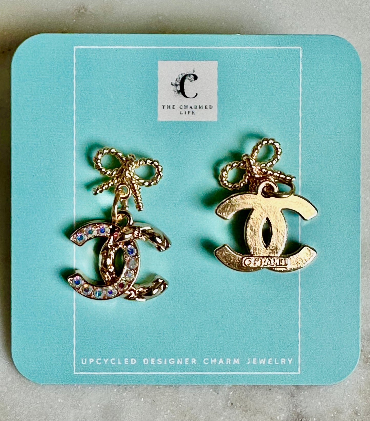 CC iridescent bow earrings
