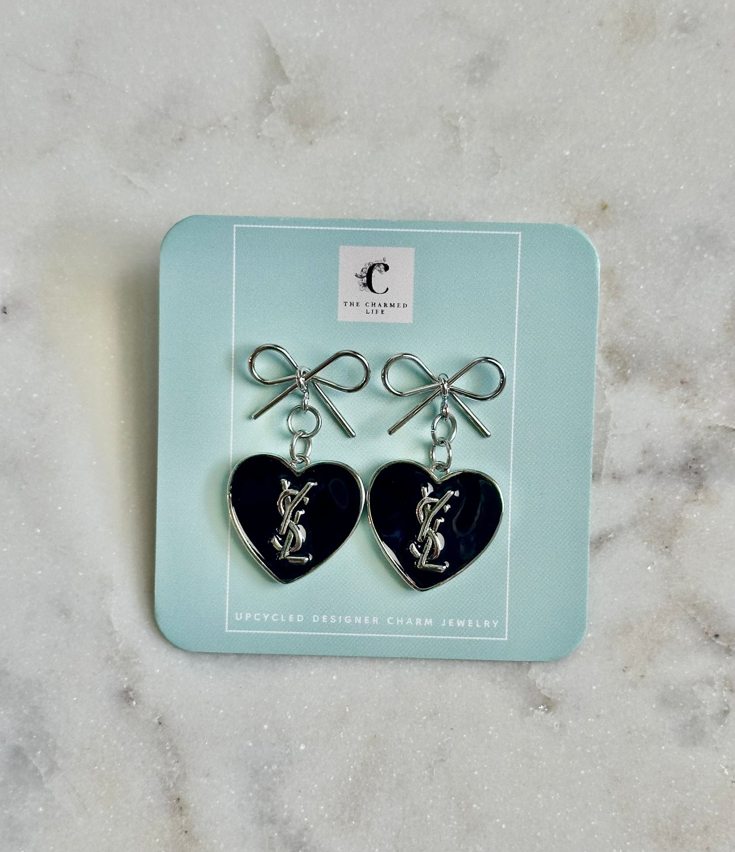 YSL black heart silver tone earrings
