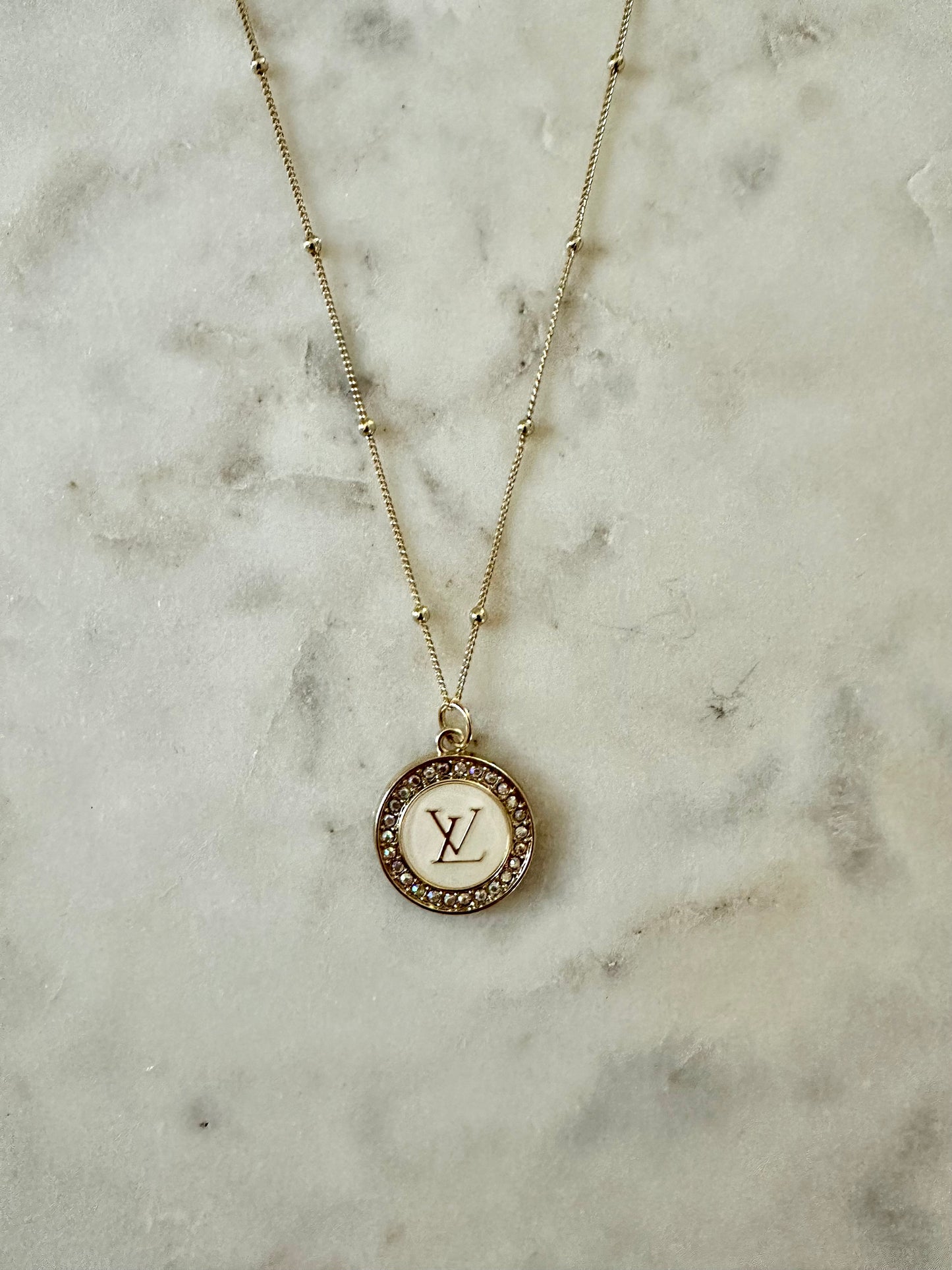LV iridescent medallion necklace