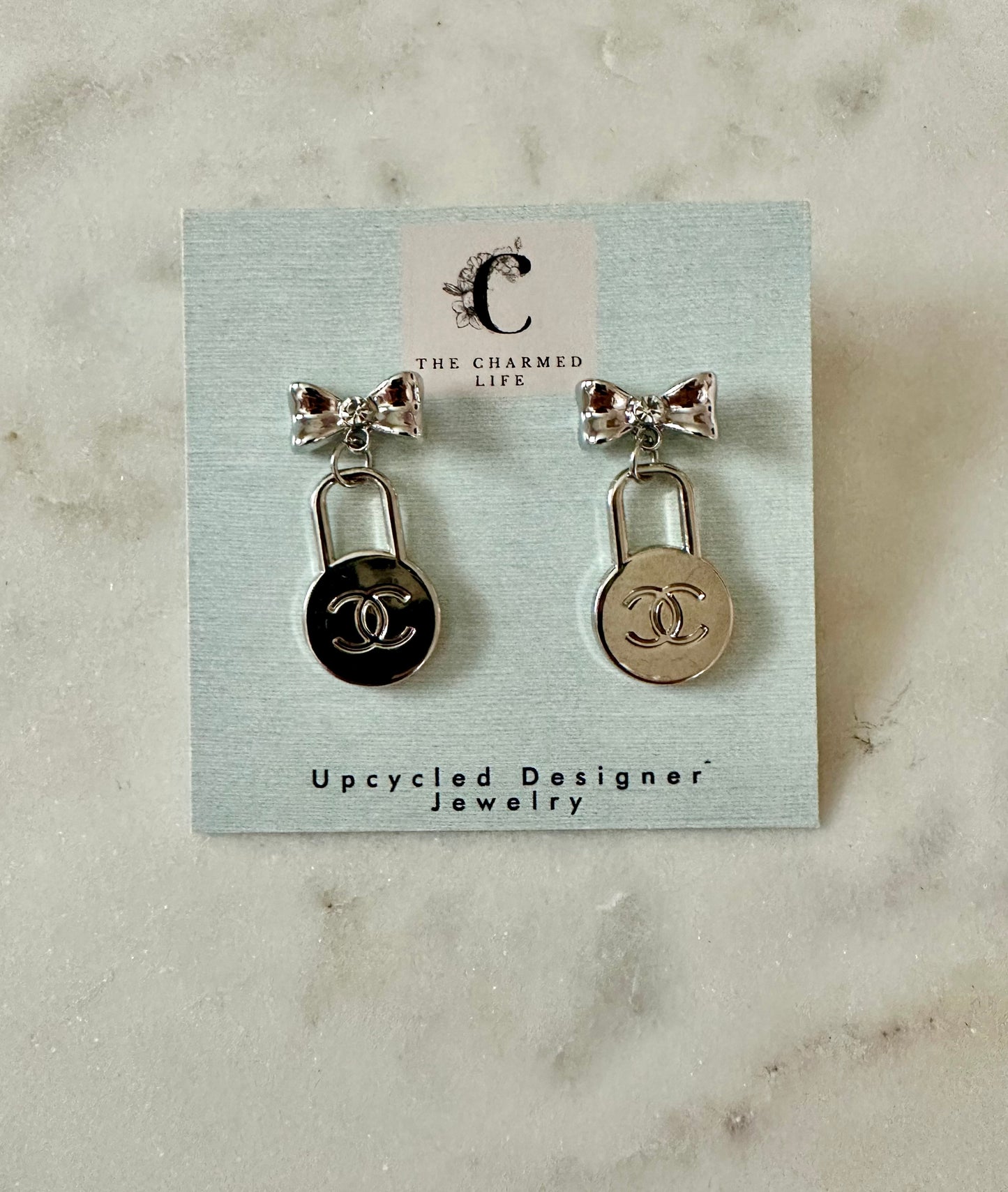 CC circle and bow earrings