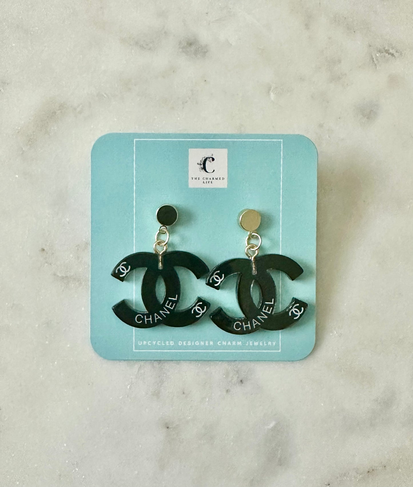 CC black resin earrings