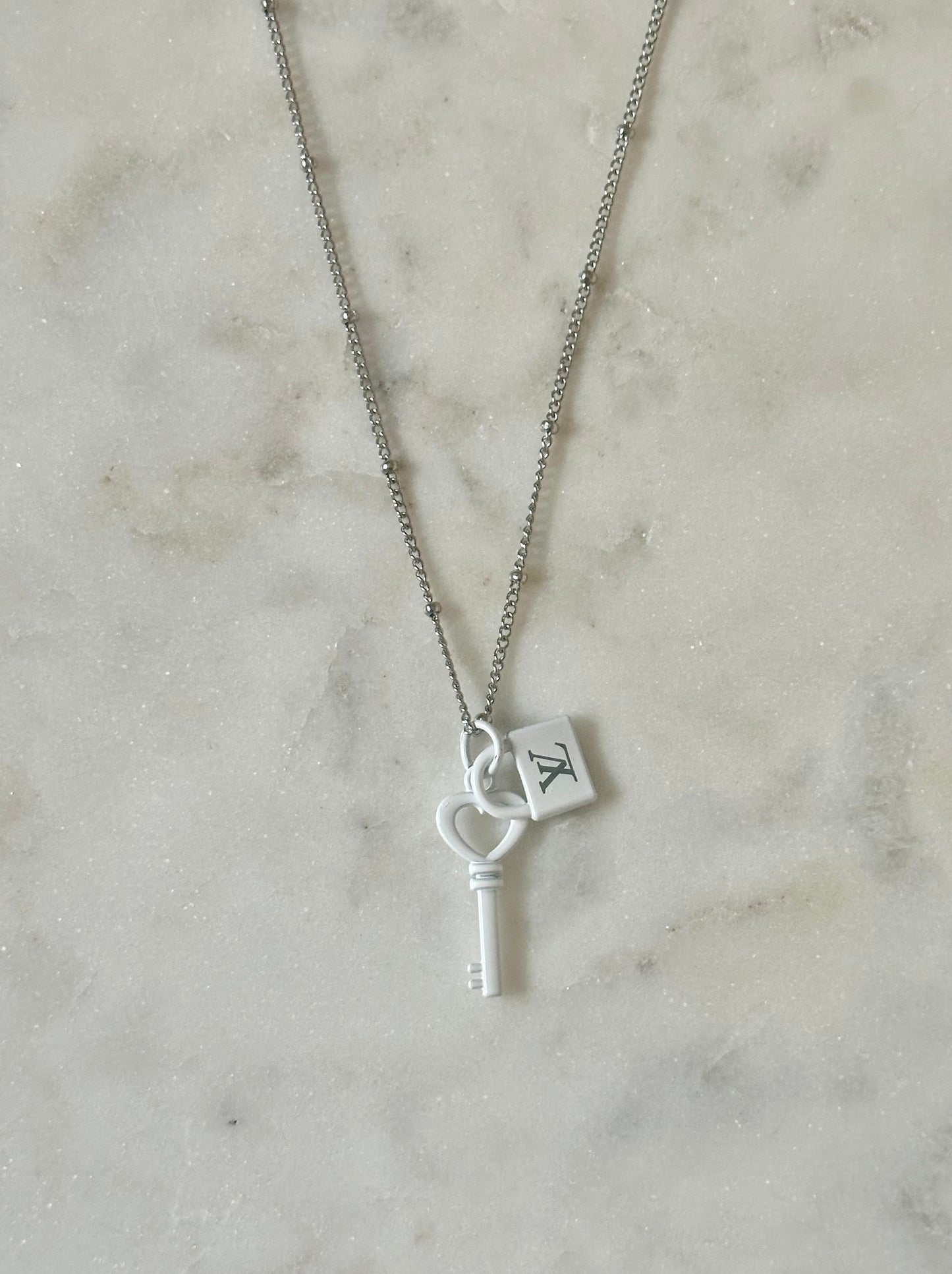 LV white lock and key necklace