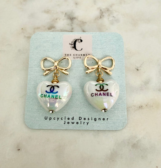 CC iridescent heart and bow earrings