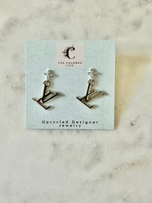 LV silver tone earrings