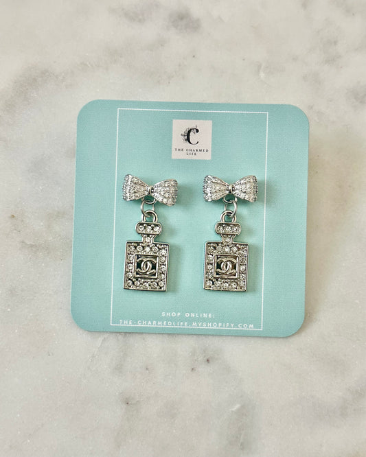 CC rhinestone perfume bow earrings silver tone