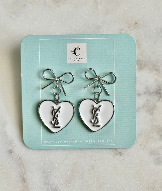 YSL white heart silver tone earrings