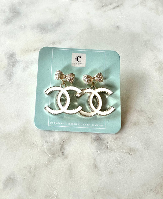 CC white and bow pendant earrings
