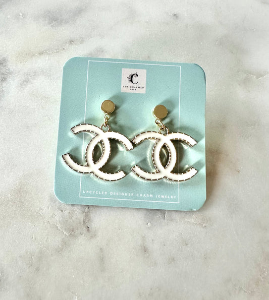 CC white pendant earrings
