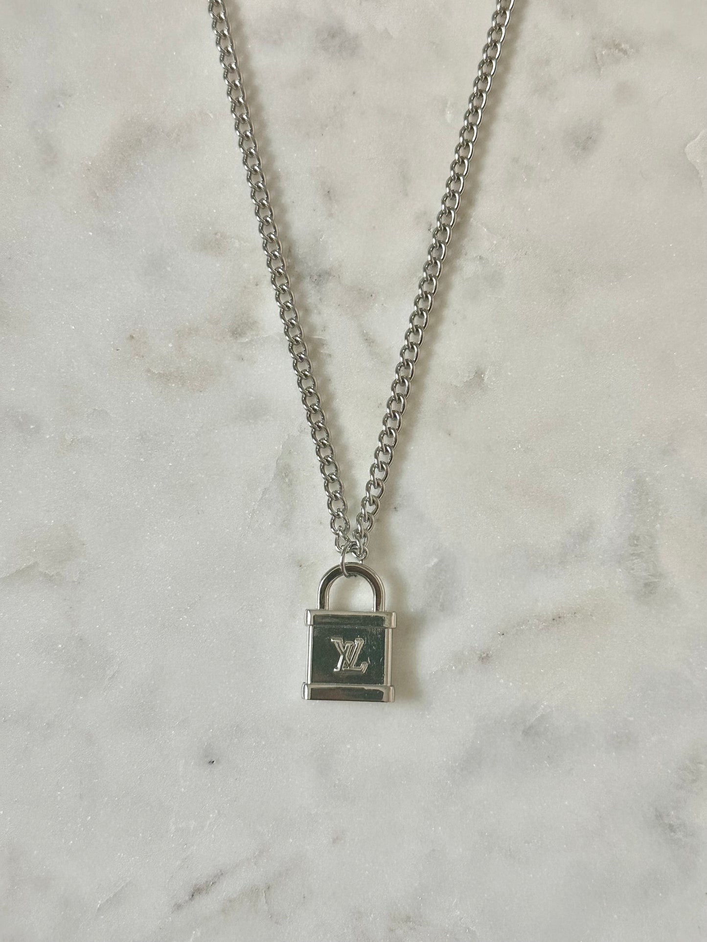 LV lock silver tone necklace