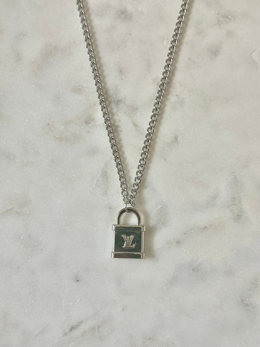 LV lock silver tone necklace