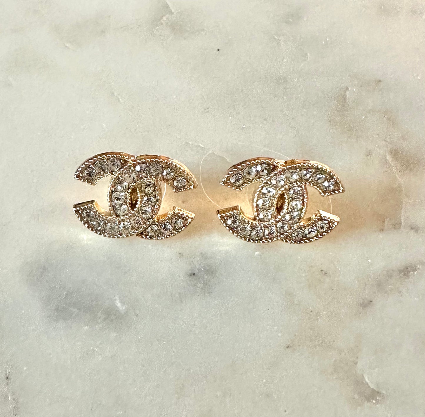 CC rhinestone and gold tone button earrings