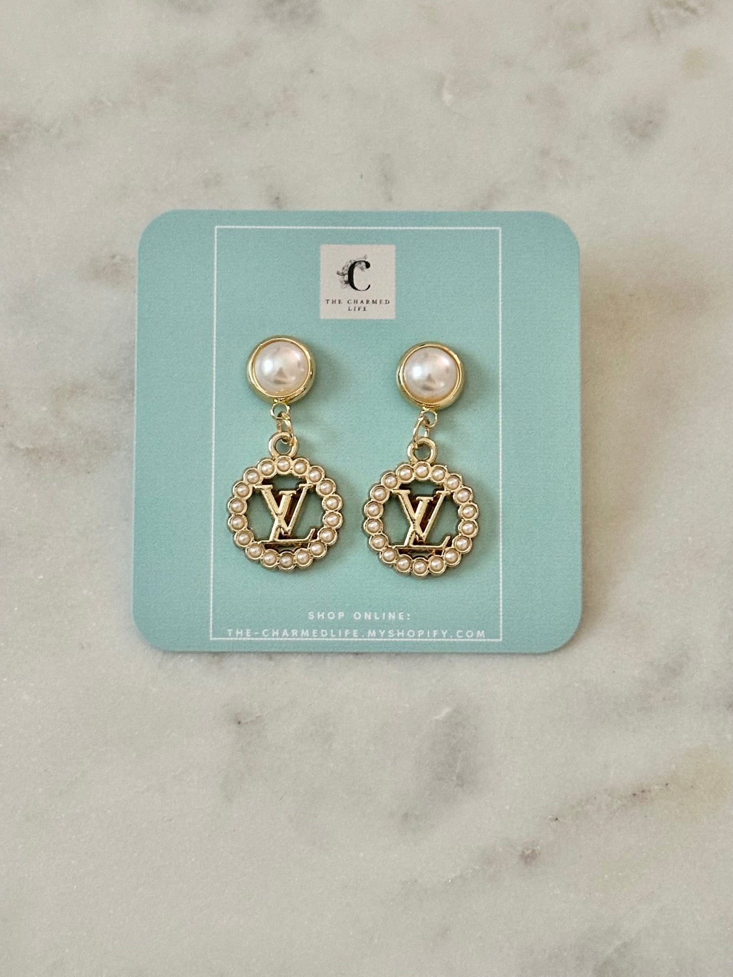 LV faux pearl earrings