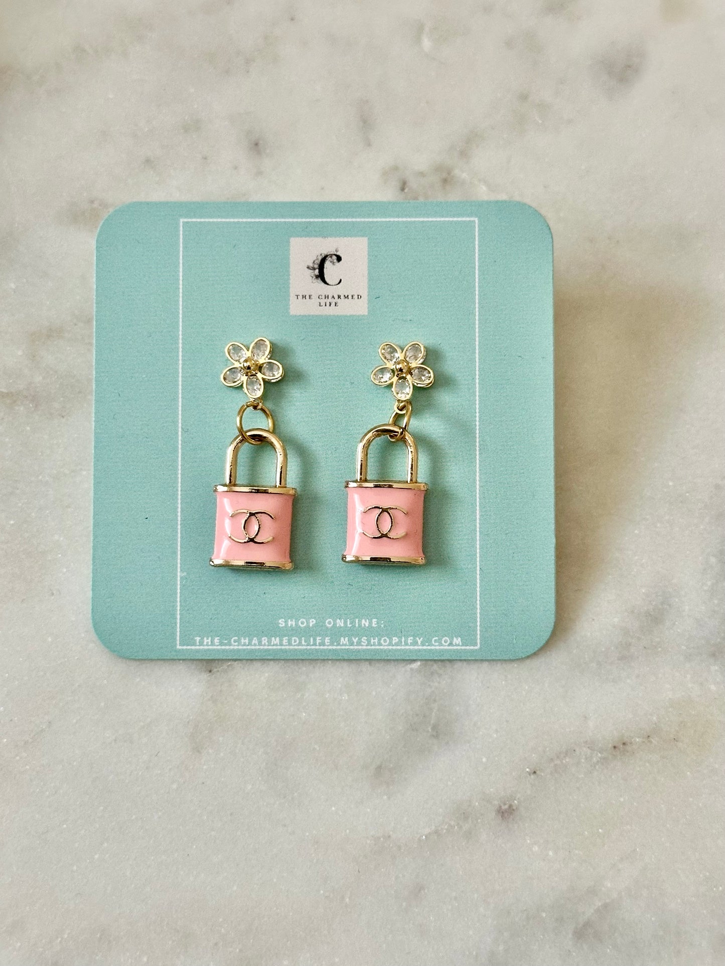 CC pink lock earrings
