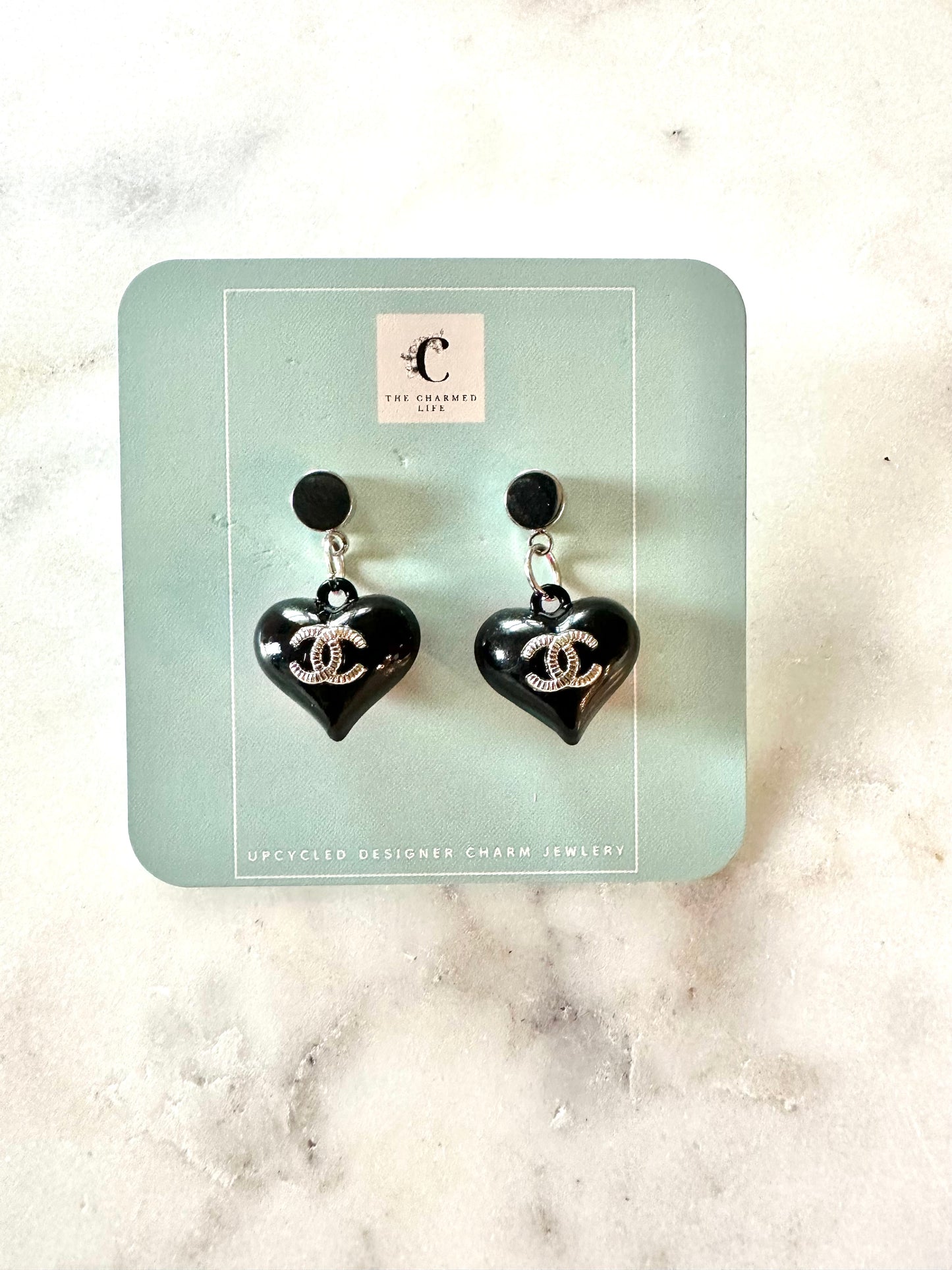 CC black and pink heart pendant earrings