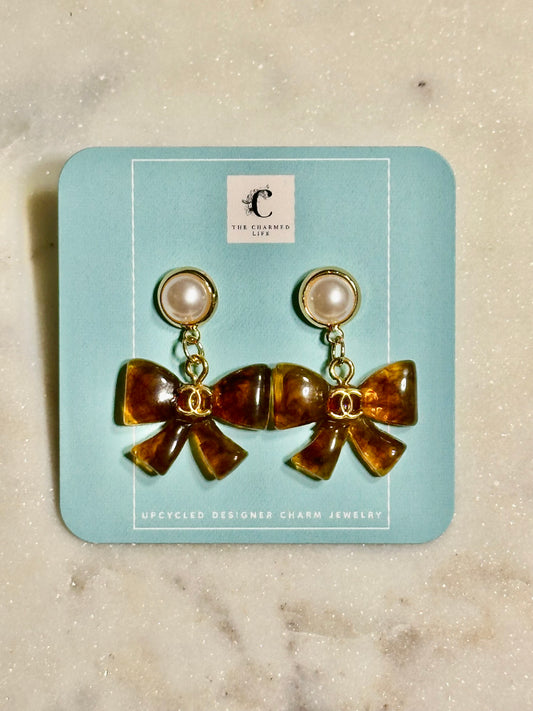 CC brown resin bow earrings