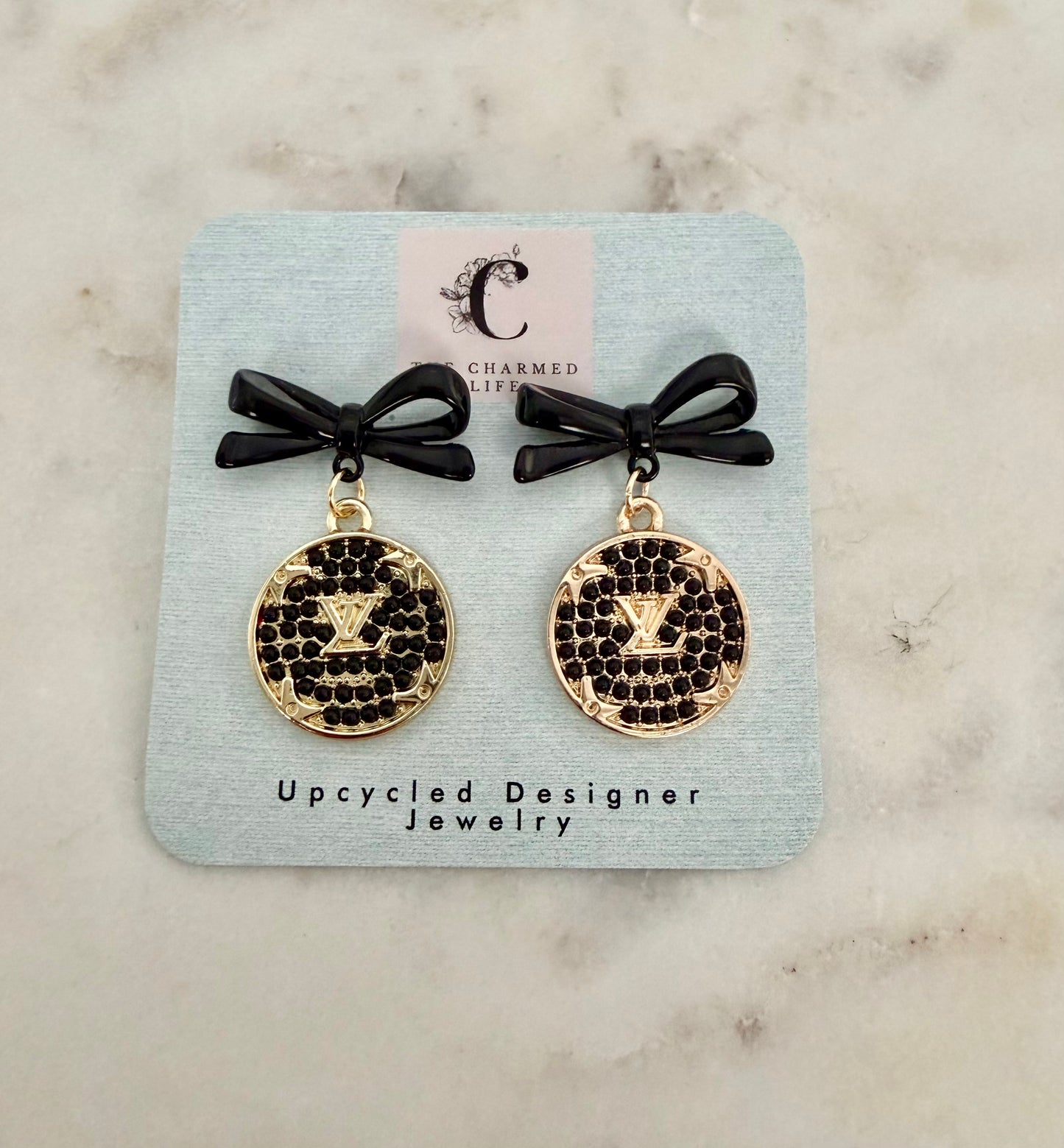LV black and gold tone earrings