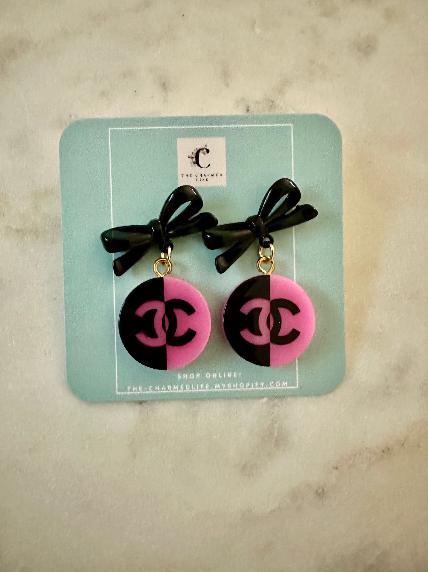 CC pink and black resin earrings