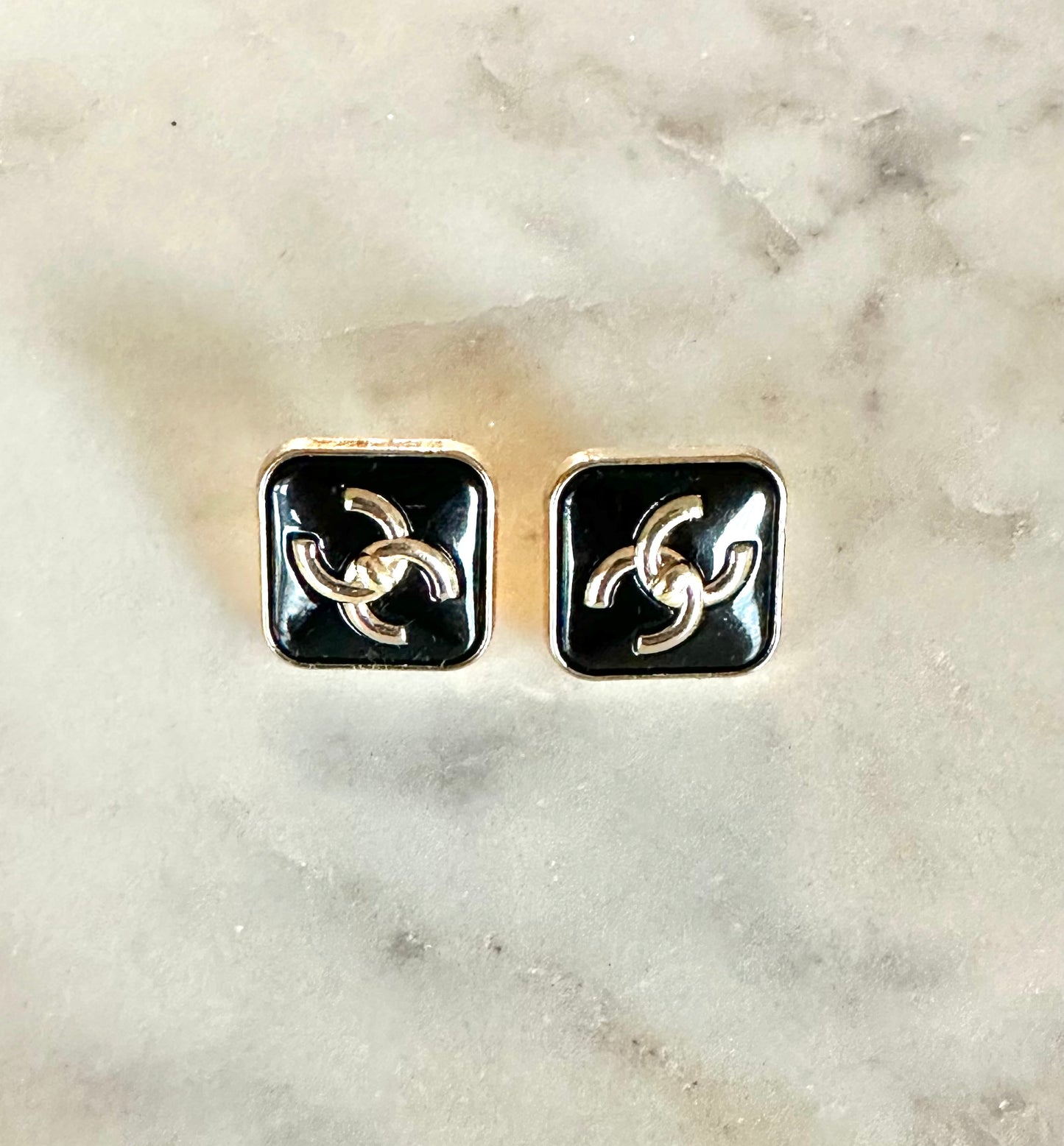 CC black turn lock button earrings