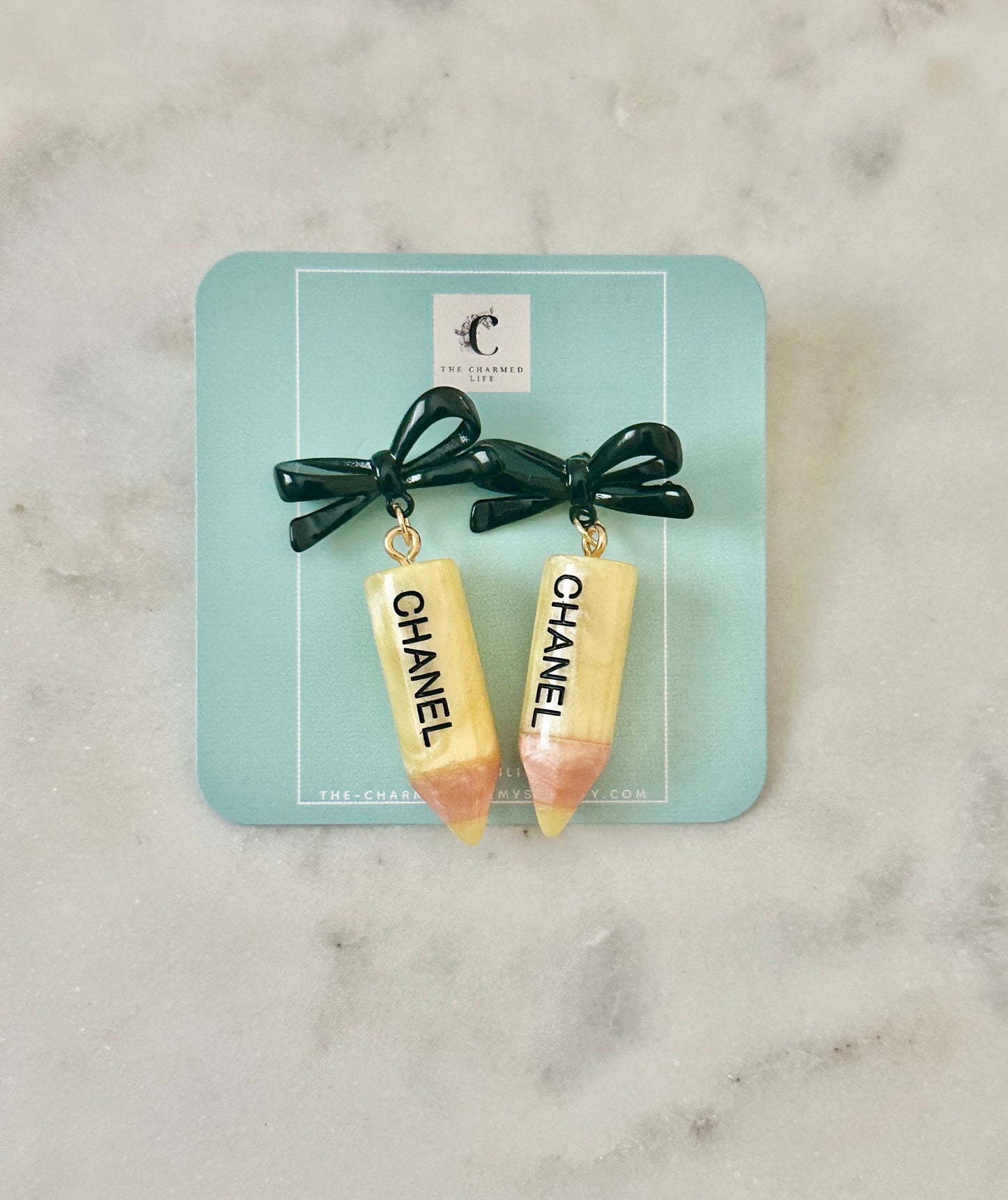 Chanel yellow pencil bow earrings