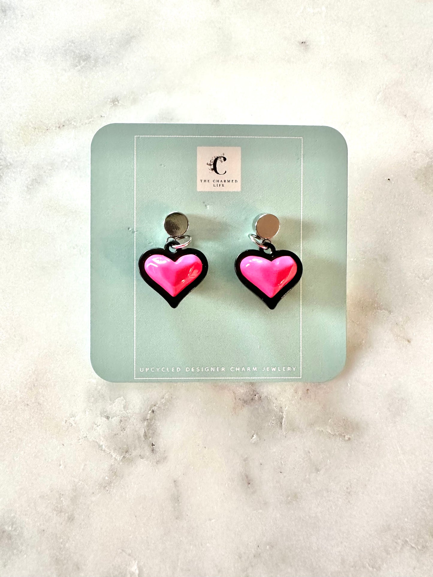CC black and pink heart pendant earrings