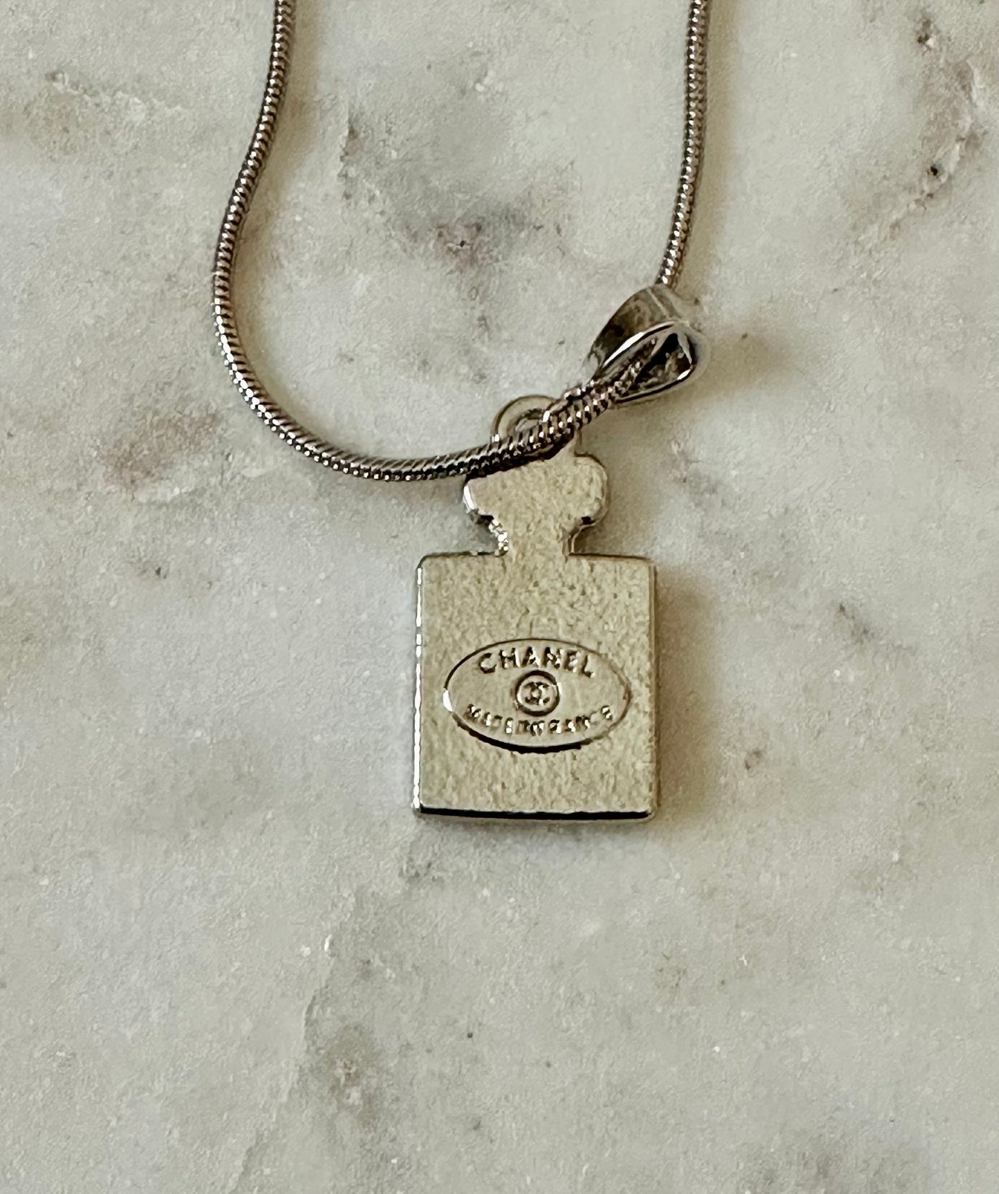 CC Perfume bottle silver tone necklace
