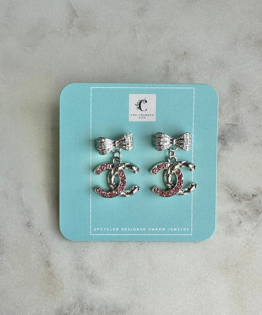 CC pink and silver bow earrings