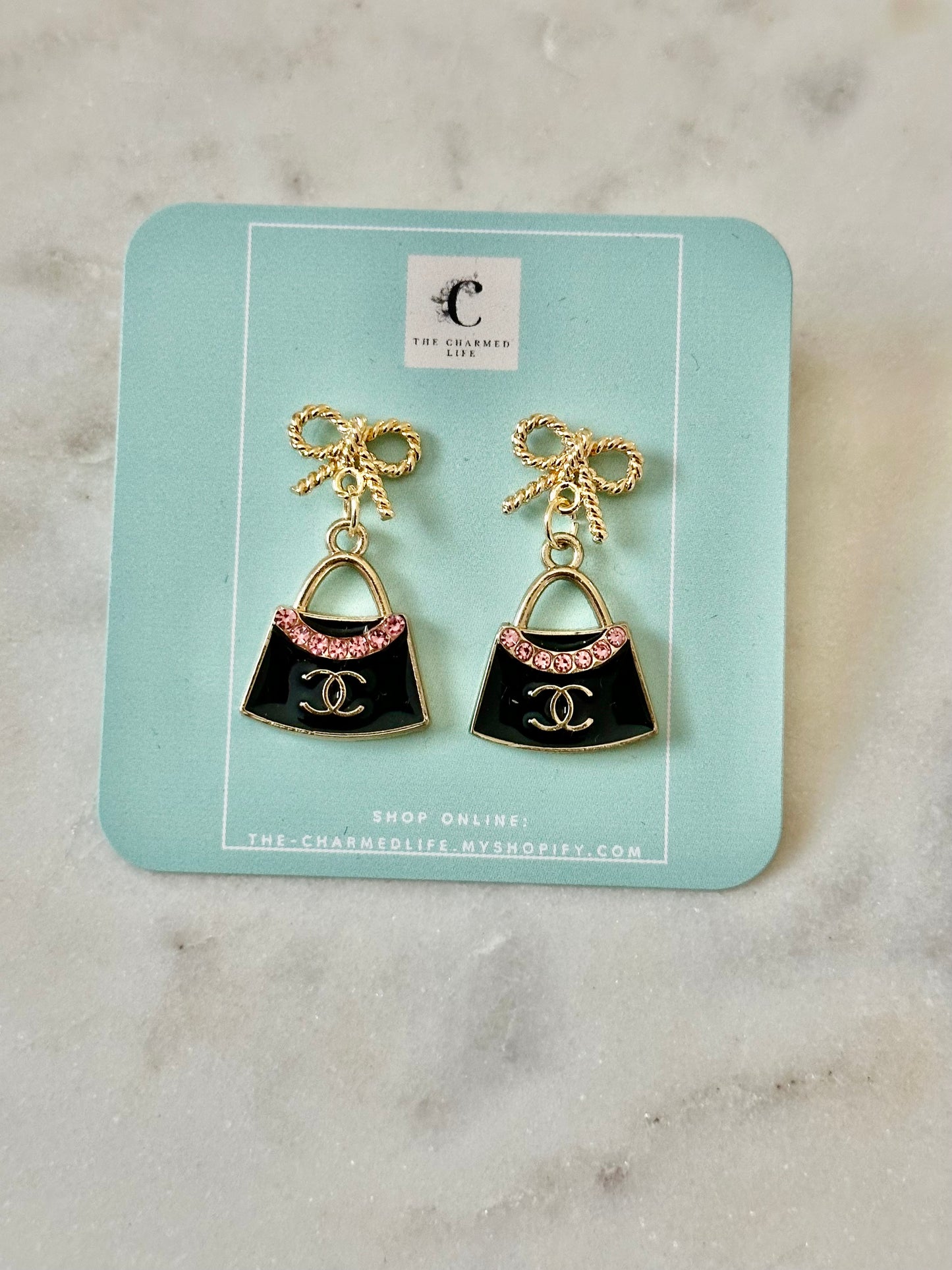 CC purse bow earrings
