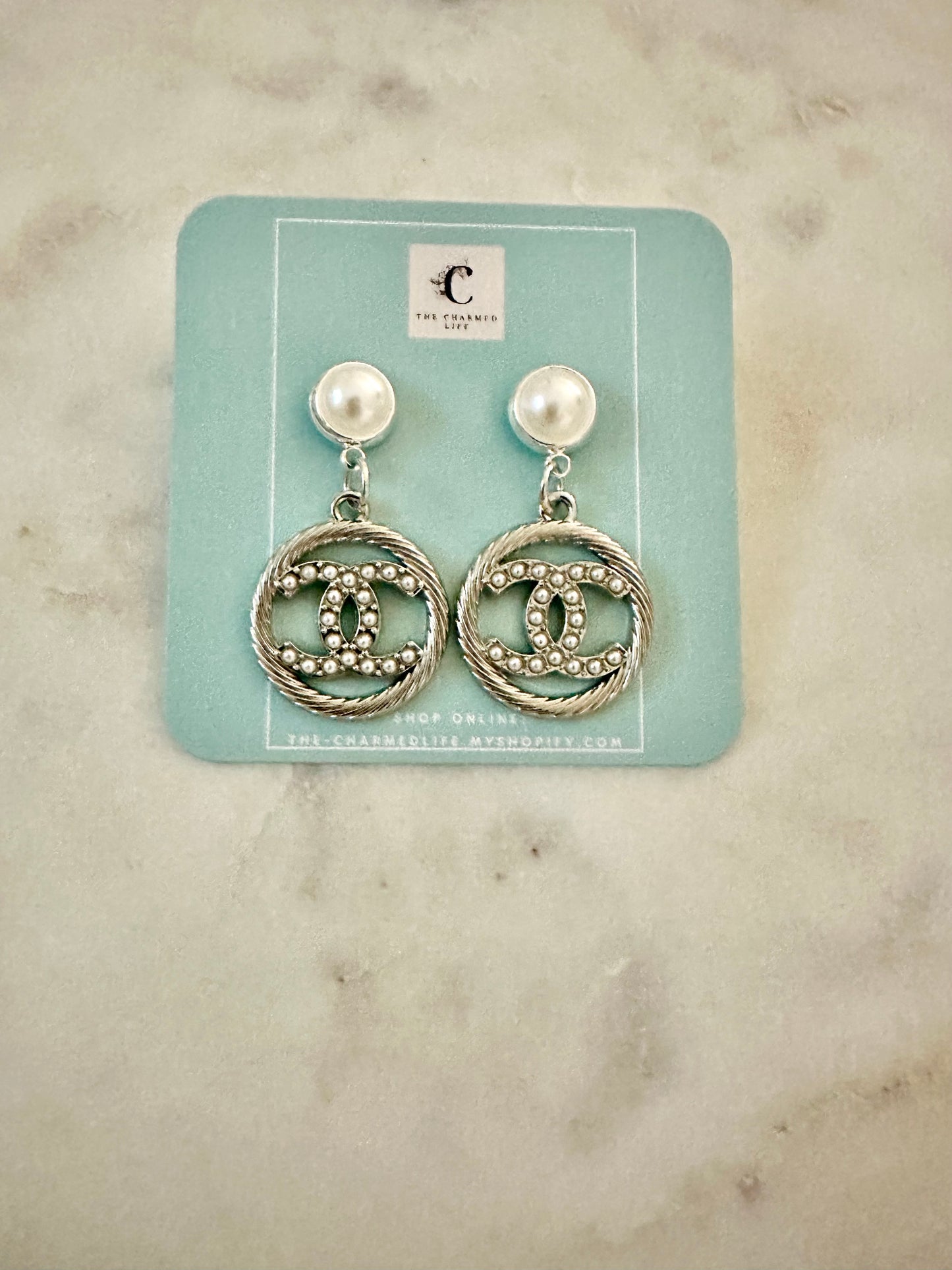 CC faux pearl/silvertone earrings