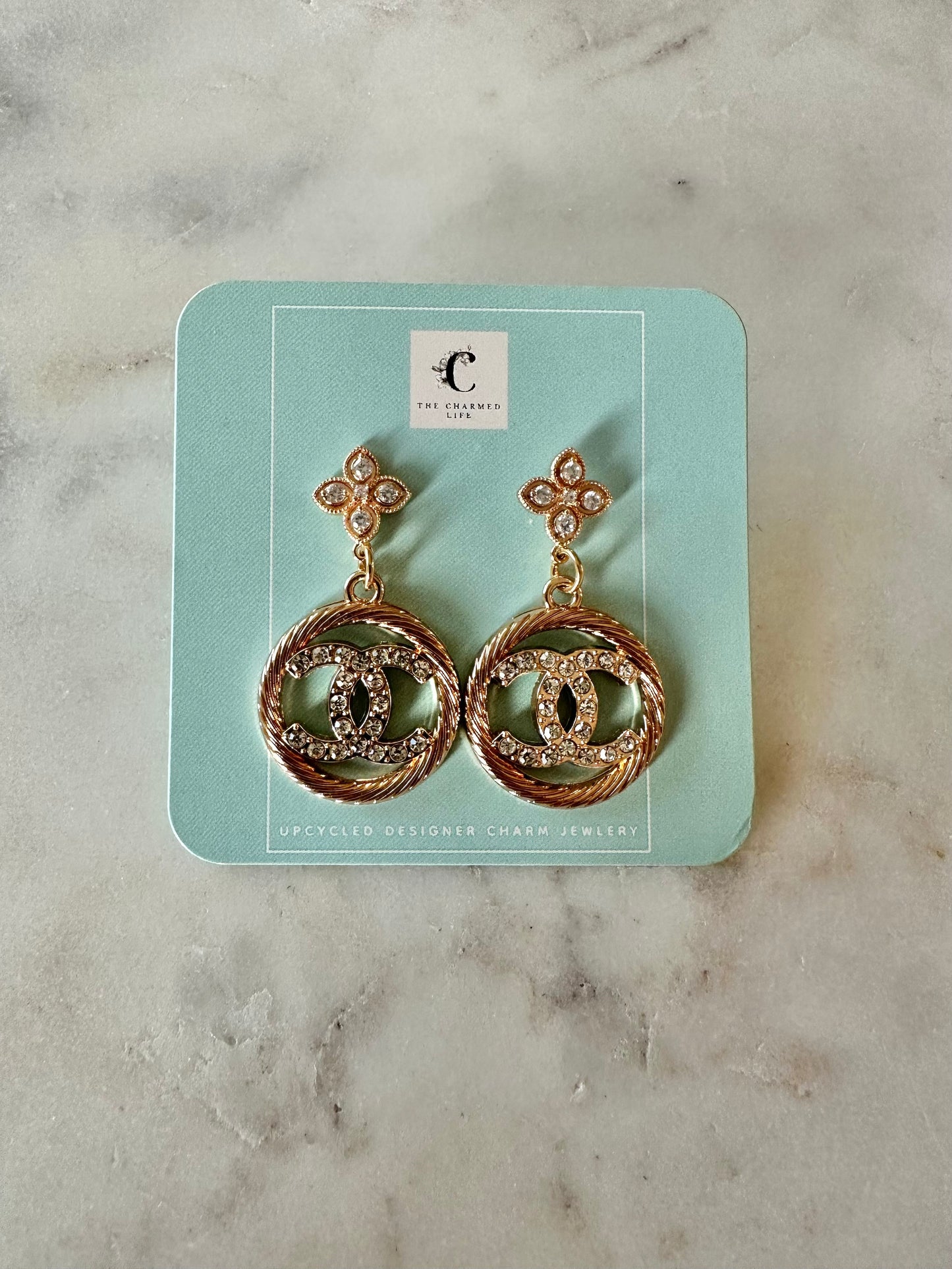 CC gold and fleur earrings